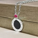 save-the-children-10th-anniversary-necklace-in-sterling-silver-with-onyx-insert-and-a-ruby-best-pricecfcd208495d565ef66e7dff9f98764da