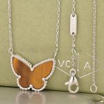 van-cleef-arpels-lucky-alhambra-butterfly-pendant-white-gold-with-tigers-eye-mother-of-pearl8e296a067a37563370ded05f5a3bf3ec