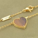 van-cleef-arpels-sweet-alhambra-heart-pendant-yellow-gold-with-tigers-eye-mother-of-pearl6f4922f45568161a8cdf4ad2299f6d23