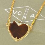 van-cleef-arpels-sweet-alhambra-heart-pendant-yellow-gold-with-tigers-eye-mother-of-pearl6f4922f45568161a8cdf4ad2299f6d23